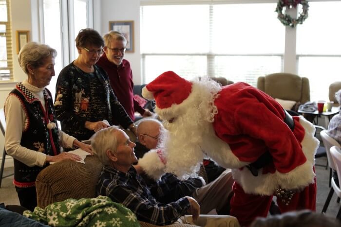 Santa talking to Don during the Christmas party