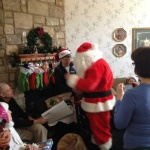 Tiffin House celebrates Christmas with Santa, stockings, wreaths, and plenty of joy