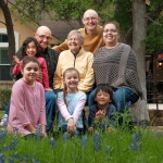 Tiffin House resident Higgie happily sits among the bluebonnets with her family