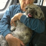 Tiffin House resident Joe embraces Rudder the dog