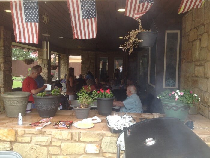 Tiffin House residents enjoy the Memorial Day Picnic on the back porch